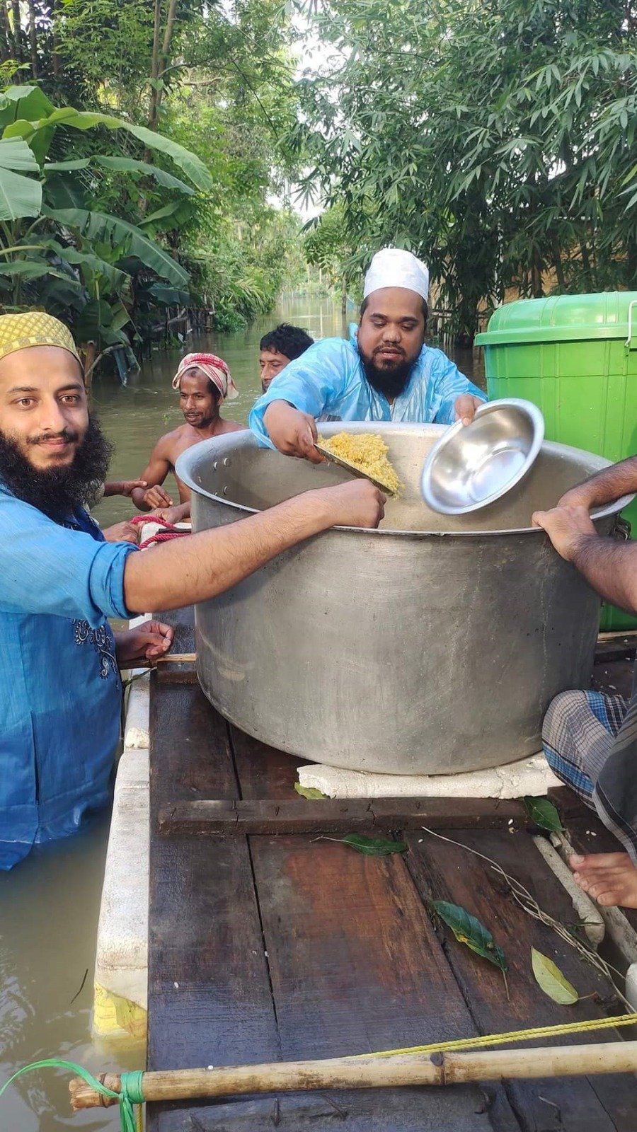 Cooked Meal Relief Provided to Waterlogged Flood Victims by Country Boat